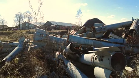 Remains of exploded ammunition, shells of multiple launch rocket systems Stock Footage 313365237