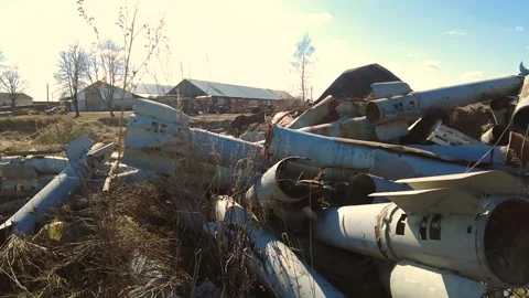 Remains of exploded ammunition, shells of multiple launch rocket systems Stock Footage 313365242