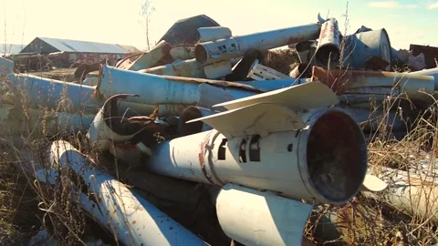 Remains of exploded ammunition, shells of multiple launch rocket systems Stock Footage 313365252