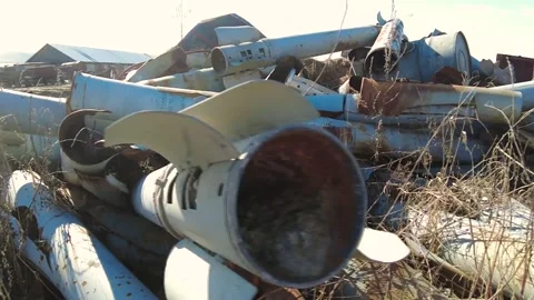 Remains of exploded ammunition, shells of multiple launch rocket systems Stock Footage 313365263