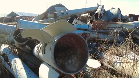 Remains of exploded ammunition, shells of multiple launch rocket systems Stock Footage 313365274
