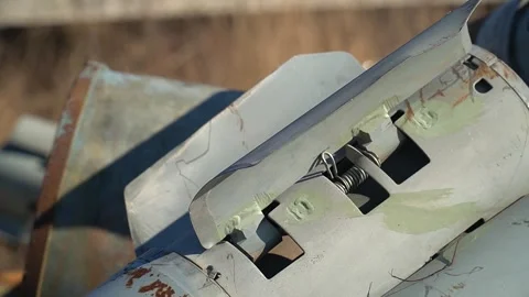 Remains of exploded ammunition, shells of multiple launch rocket systems Stock Footage 313365723