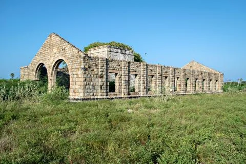 Remains of old heritage stone structure of abandoned steam locomotive shed. Stock Photos