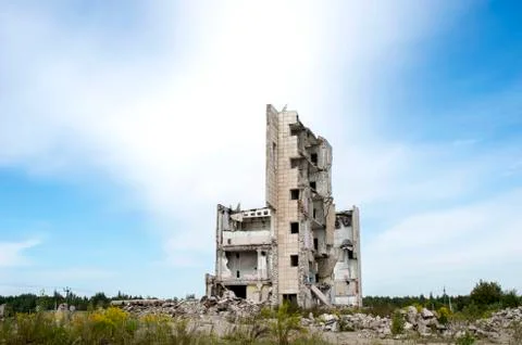 The remains of the structure of a large destroyed building with concrete gray Stock Photos