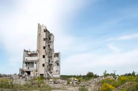 The remains of the structure of a large destroyed building with concrete gray Stock Photos