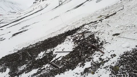 Remains of Svalbard taubane (coal cableway) tower after avalanche Stock Footage 274288407