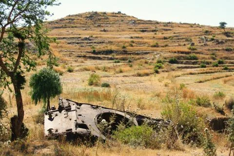 The remains of a tank at the edge of the road in  Western Eritrea Stock Photos