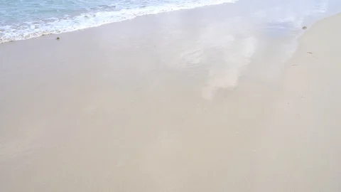 The remains of the wave on the sand create something relaxing 스톡 동영상 128407258