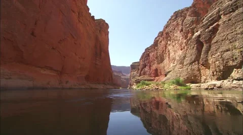 Remarkable aerial from rim of Grand Canyon to white water raft on river. Stock Footage