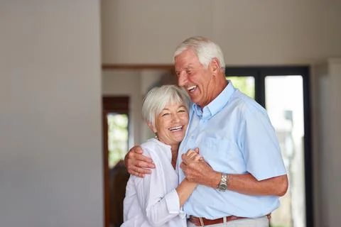 Remember our first dance. a happy senior couple at home. Stock Photos