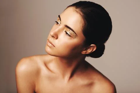 Remembering the golden rules. Studio shot of a beautiful woman looking away Stock Photos