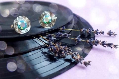 Remembering the nineties: old records, cufflinks, dry lavender branches on a  Stock Photos