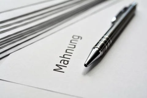 A reminder and a biro lie on a table in the office Stock Photos