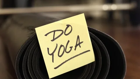 Reminder Note To Do Yoga Attached To A Yoga Mat Stock Footage 337679263