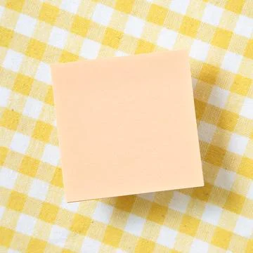 Reminder sticky notes on yellow check pattern fabric background Stock Photos