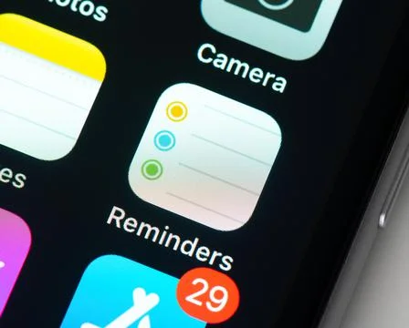 Reminders app icon on Apple iPhone screen Photos