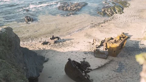 Remnants of old rusted ship on beach shore Stock Footage 228907792