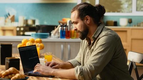 Remote administrator, laptop displaying analytics, charts and research data 스톡 사진