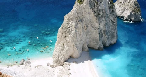 Remote beach with huge white rock formation with blue lagoon, tourist pleasure Video stock 140251830
