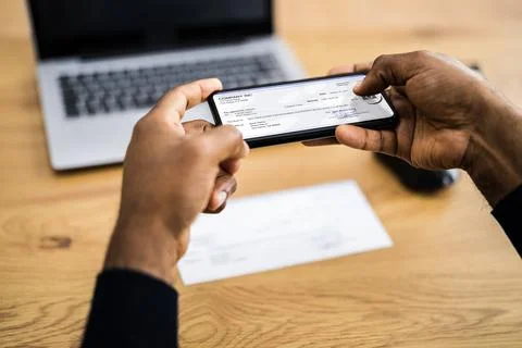 Remote Check Deposit Using Mobile Remote Stock Photos