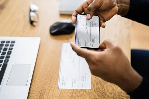 Remote Check Deposit Using Mobile Remote Stock Photos