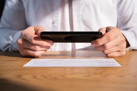 Remote Check Deposit Using Mobile Remote Stock Photos