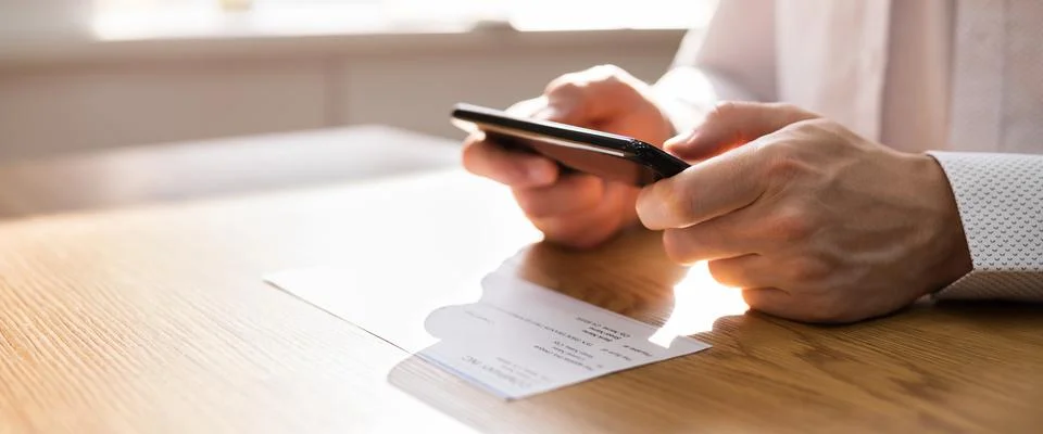 Remote Check Deposit Using Mobile Remote Stock Photos