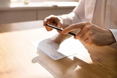 Remote Check Deposit Using Mobile Remote Stock Photos
