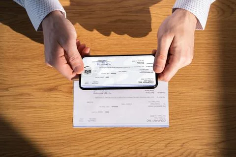 Remote Check Deposit Using Mobile Remote Stock Photos