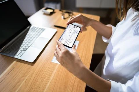 Remote Check Deposit Using Mobile Remote Stock Photos