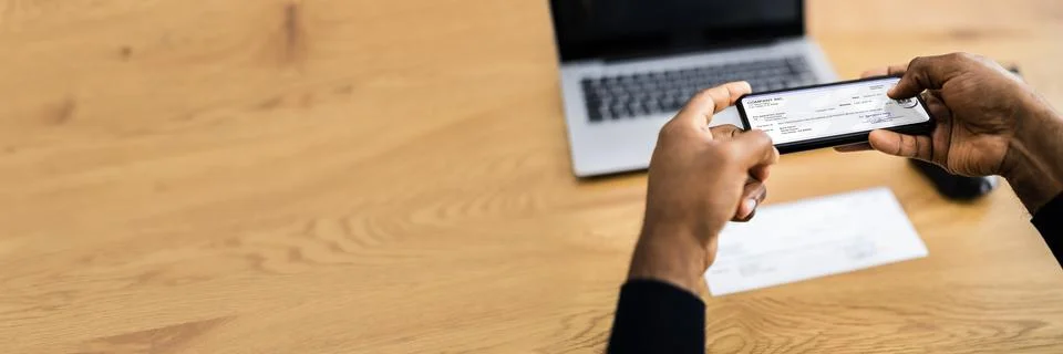 Remote Check Deposit Using Mobile Remote Stock Photos