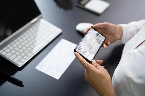 Remote Check Deposit Using Mobile Remote Stock Photos