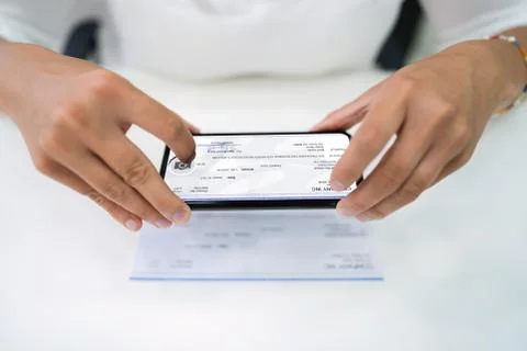 Remote Check Deposit Using Phone Stock Photos