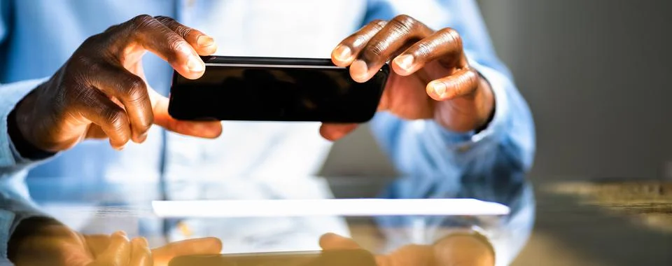 Remote Cheque Deposit Using Mobile Phone Stock Photos