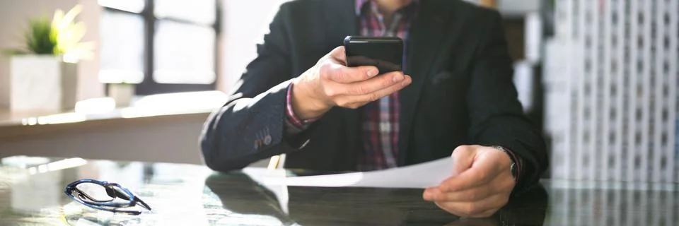 Remote Cheque Deposit Using Mobile Phone Stock Photos
