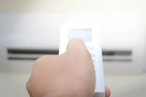 Remote control air conditioner concept Stock Photos