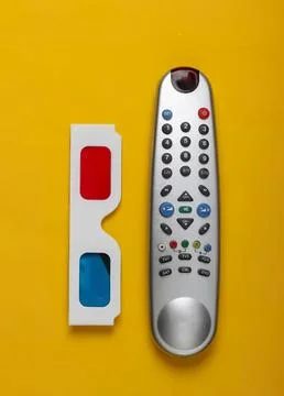 Remote control and 3d glasses on yellow background Stock Photos