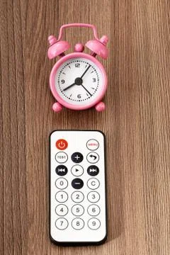 Remote control and alarm clock Fotos de archivo
