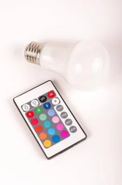 Remote control and LED bulb isolated on the white Stock Photos