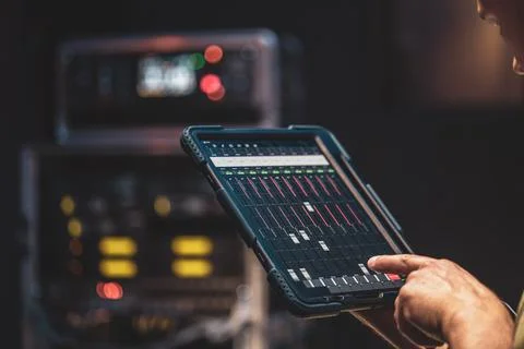 Remote control and sound settings from the tablet. Stock Photos