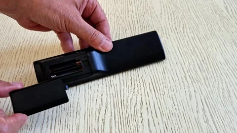 Remote Control Battery Cover Opening and Battery Replacement Demo Stock Footage 340746755