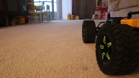 Remote control car driving in living room forward and back real time motion Stock-Footage 127357101