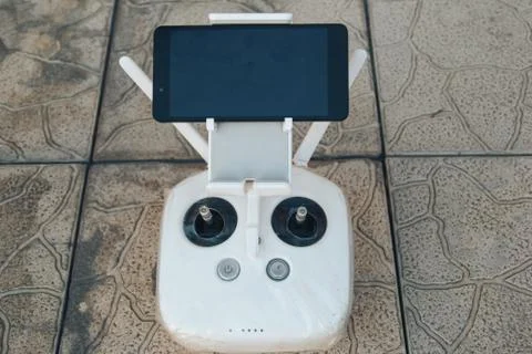 Remote control drone close up with phone Stock Photos