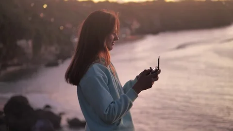 Remote control of the drone in the hands of the girl close-up. 4k Stock-Footage 124903361