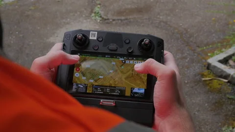 Remote control of a drone pilot operating Stockbeeldmateriaal 158667083
