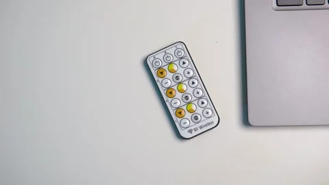 Remote control of the equipment on white table Stock Footage 238074360