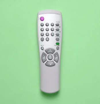 Remote control on green background with buttons and display Stock Photos