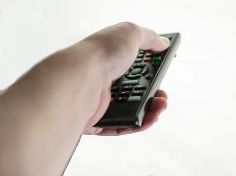 Remote control in hand closeup with background removed Stock Photos
