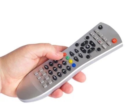 Remote control in hand Stock Photos