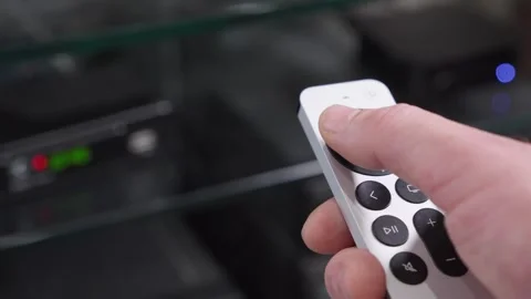 Remote control is in hands of man who changes channels. Stock Footage 281553319